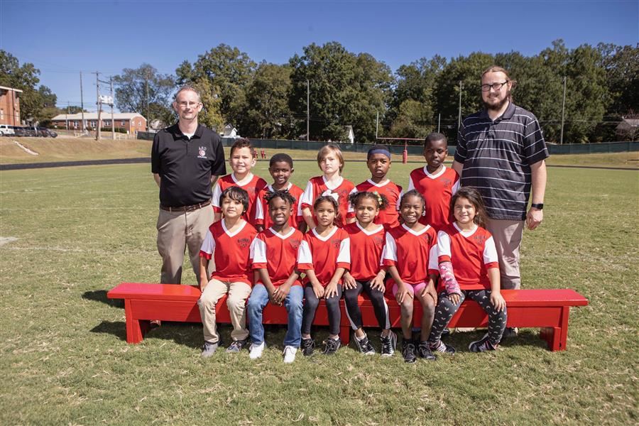 Members of the ASD Rec League Minor soccer team pose for a team photo.