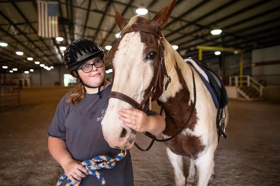 student with horse student with horse