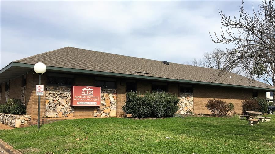 Image of the outside of the regional center a stone side office building with sign. Image of the outside of the regional center a stone side office building with sign.
