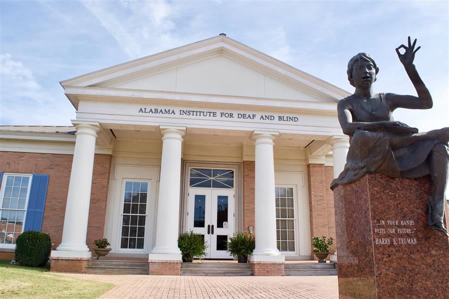 front of AIDB Shoals Regional Center with Hellen Keller Statue