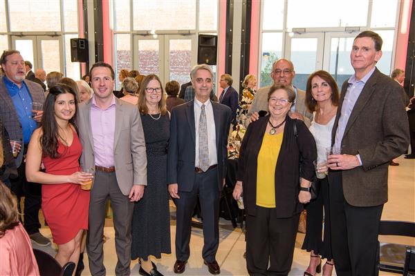 Dr. Ash Tilak; Grant Howard; Dr. Nancy Mascia; John Mascia, Au.D.; Teresa and Tony Petelos; and Rebecca and Clay Carr smile to camera.