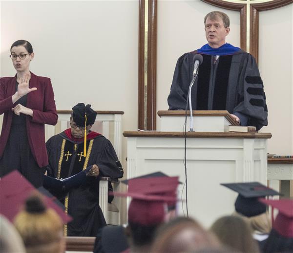 Allen Cope speaks to the graduates at Baccalaureate.